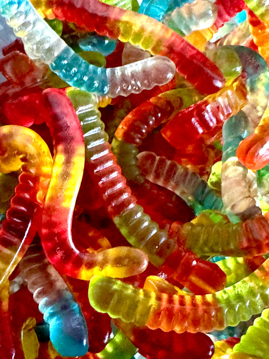 Multi coloured gummy worms in a jar 