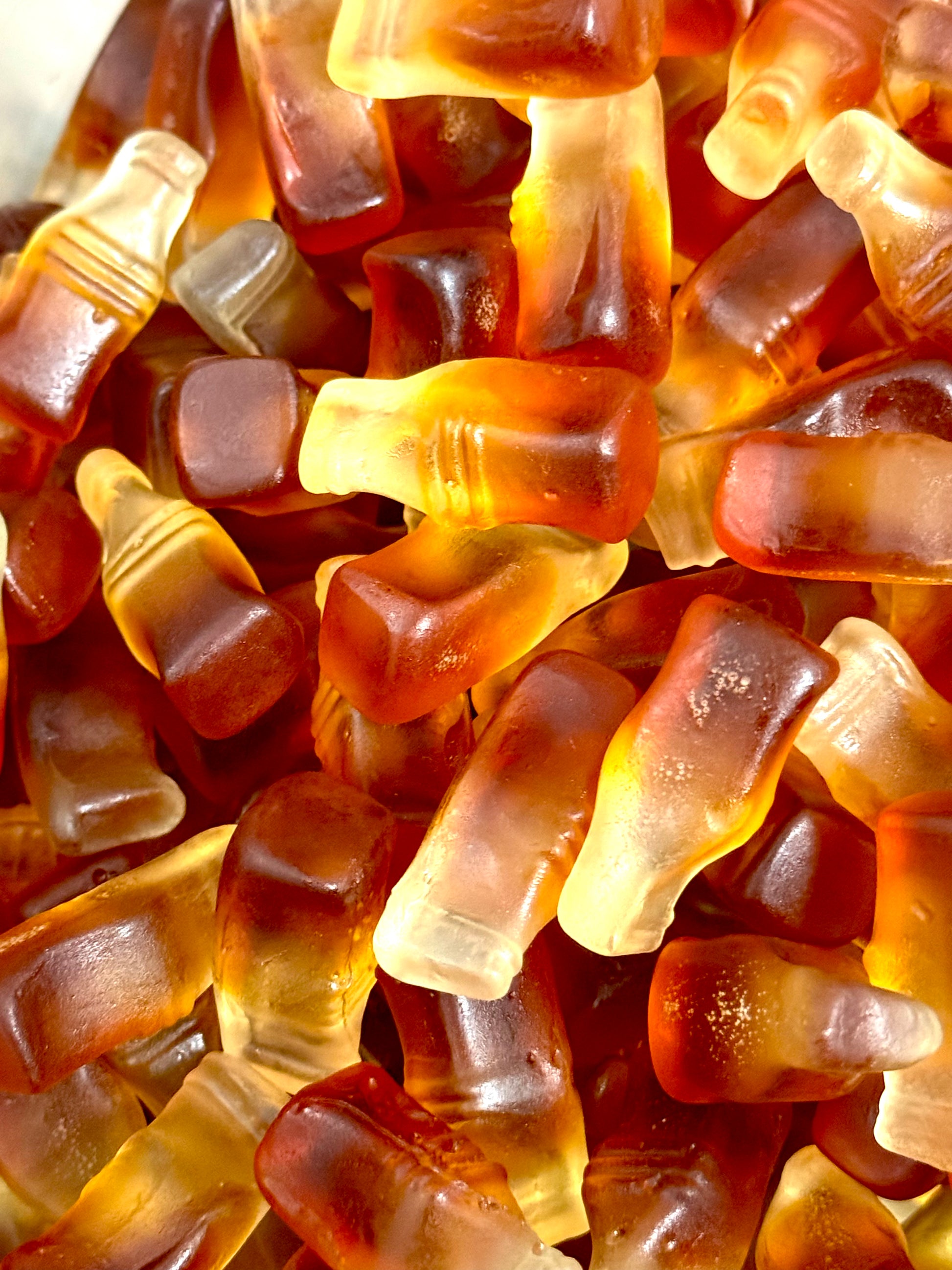 Gummy cola bottles in a jar 